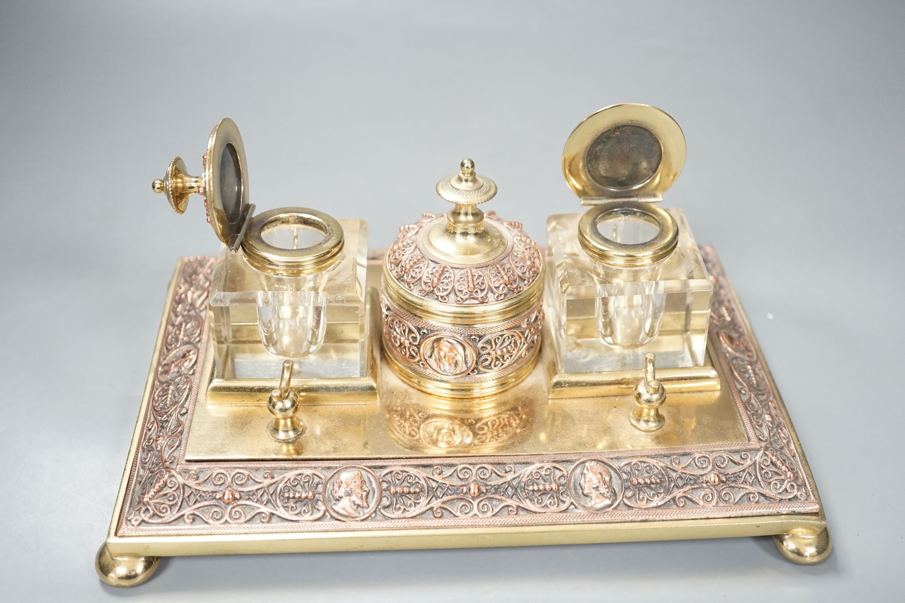 A 19th century copper and brass two bottle inkstand. Length 24cm